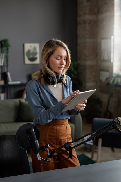 Medium shot woman getting ready for podcast