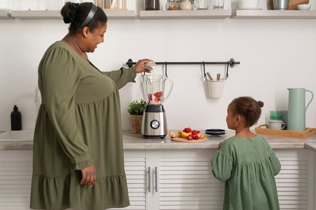 medium shot woman and girl with food