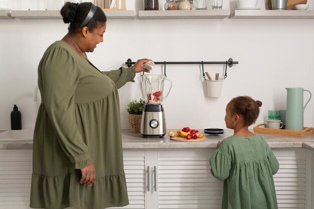 Medium shot woman and girl with food