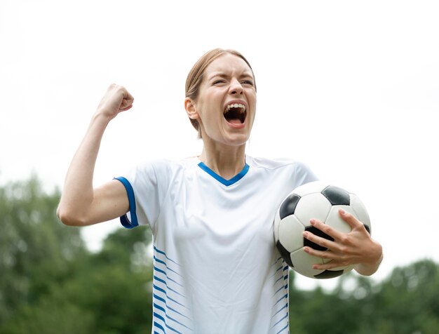 Medium shot woman holding ball