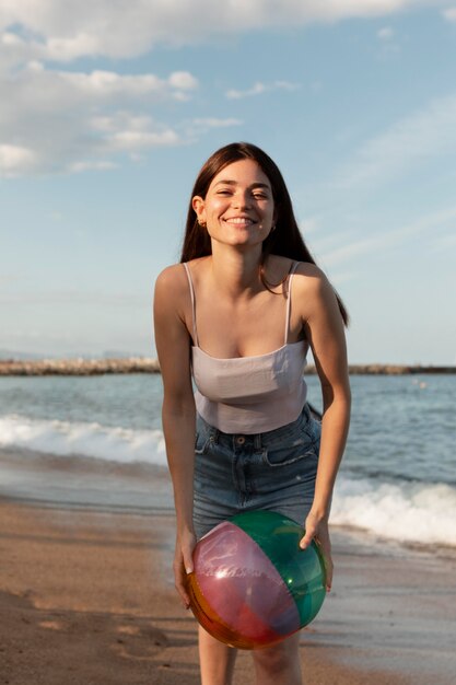 Medium shot woman holding ball