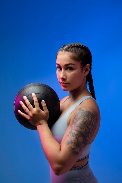 Medium shot woman holding ball