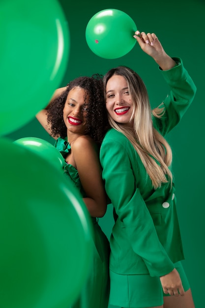 Free photo medium shot woman holding balloon