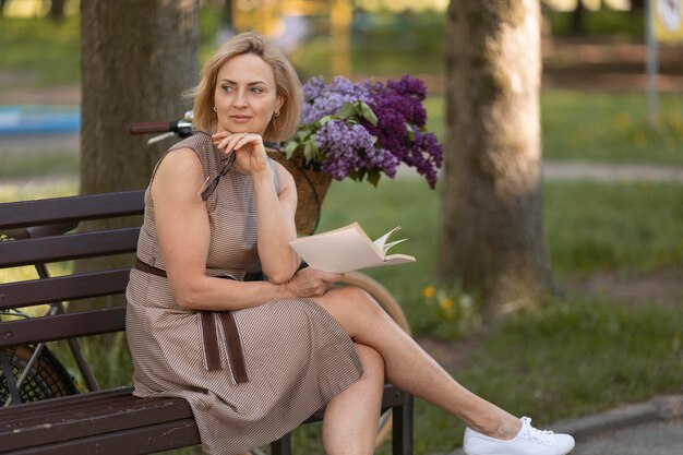 Medium shot woman holding book