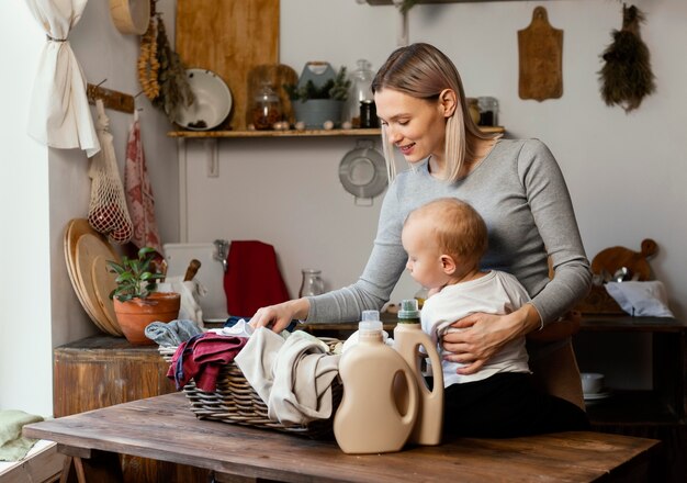 Medium shot woman holding child