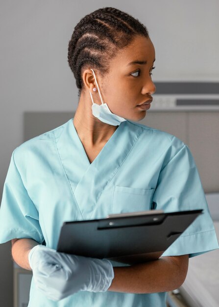 Medium shot woman holding clipboard