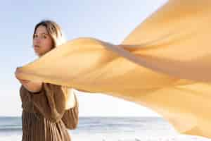 Free photo medium shot woman holding cloth