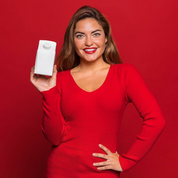 Medium shot woman holding container