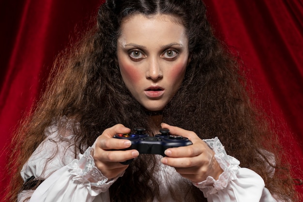 Medium shot woman holding controller