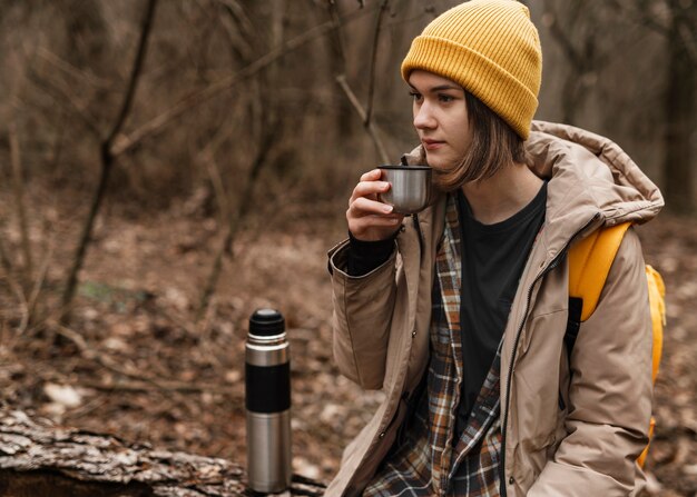 Medium shot woman holding cup