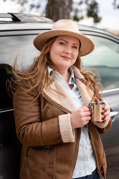 Medium shot woman holding cup