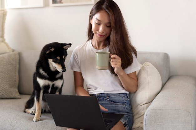 Medium shot woman holding cup