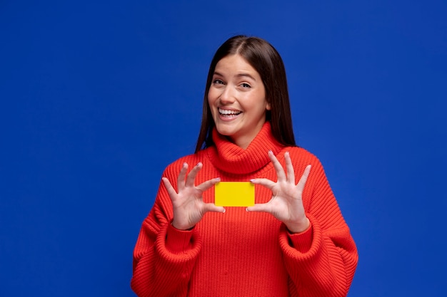 Medium shot woman holding empty card