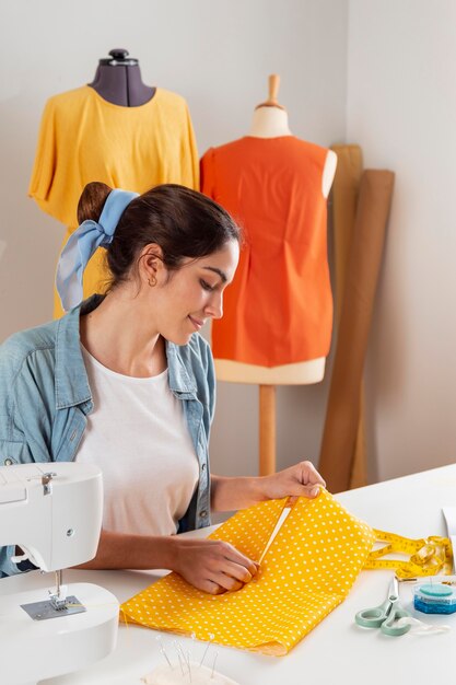 Medium shot woman holding fabric