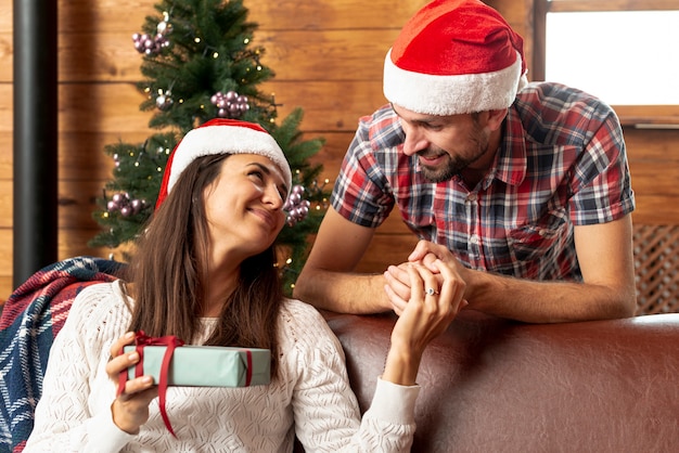 Medium shot woman holding her husband's hands