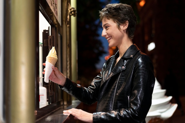 Medium shot woman holding ice cream