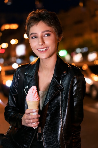 Medium shot woman holding ice cream