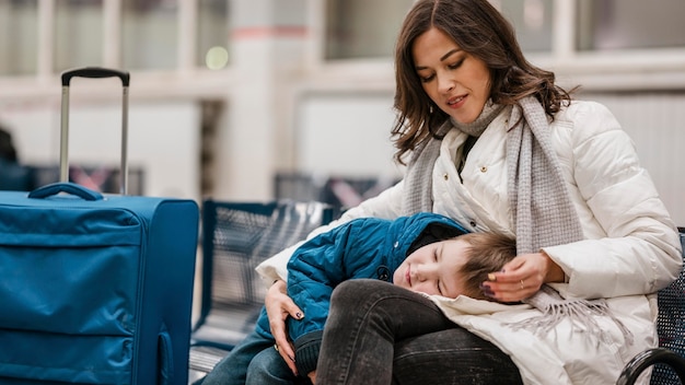 Medium shot woman holding kid