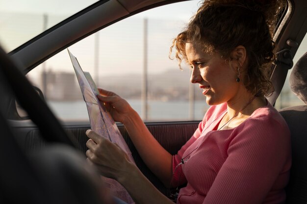 Medium shot woman holding map