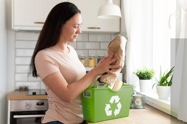 medium shot woman holding paper bag