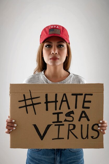 Medium shot woman holding placard