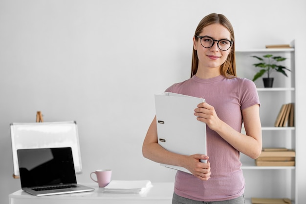 Medium shot woman holding project