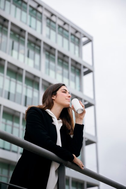 Medium shot woman holding soda can