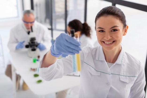 Medium shot woman holding tubes