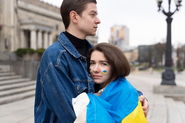 Medium shot woman hugging man