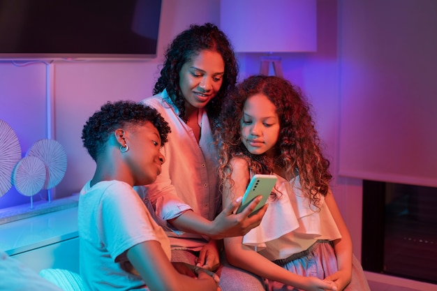 Medium shot woman and kids spending time at home