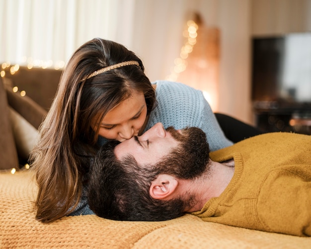 Medium shot woman kissing lover