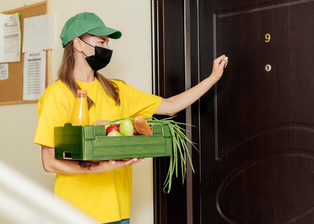 Medium shot woman knocking on door