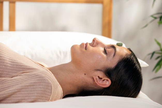 Medium shot woman laying in bed