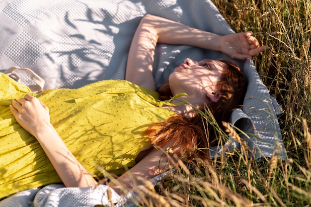 Medium shot woman laying on cloth