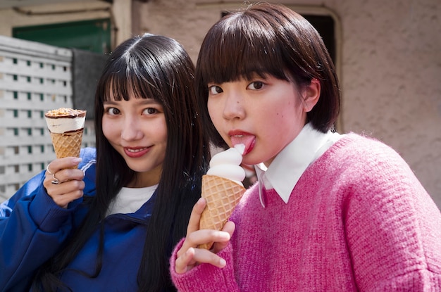 Medium shot woman licking ice cream cone