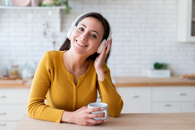 Medium shot of woman listening to music