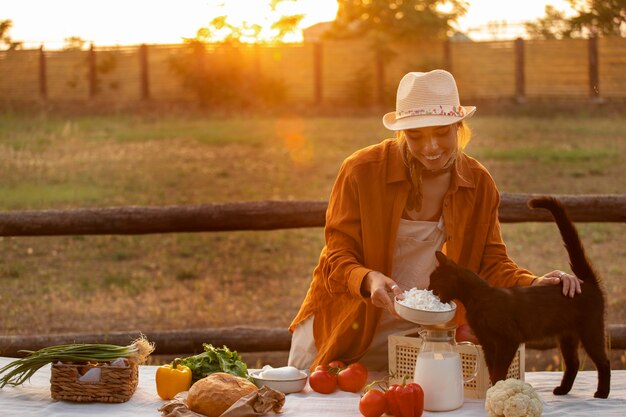 Medium shot woman living at farmhouse