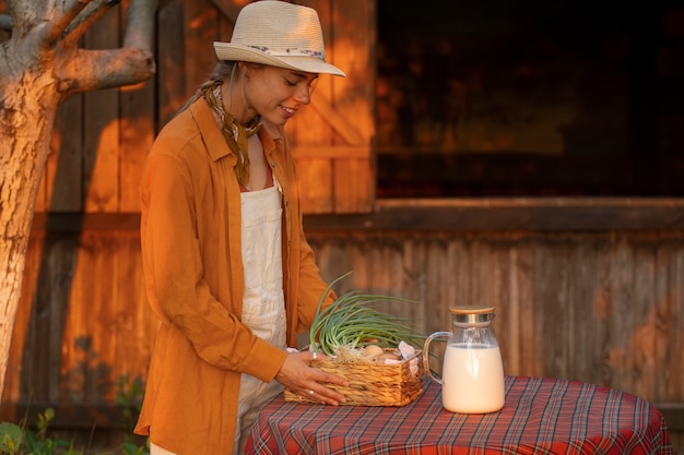 Medium shot woman living at farmhouse