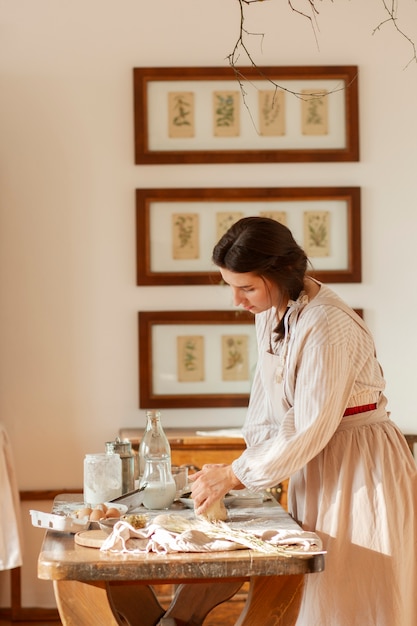 Medium shot woman living at farmhouse