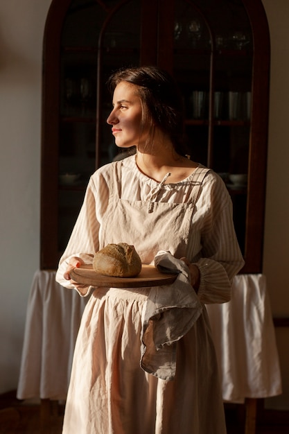 Medium shot woman living at farmhouse