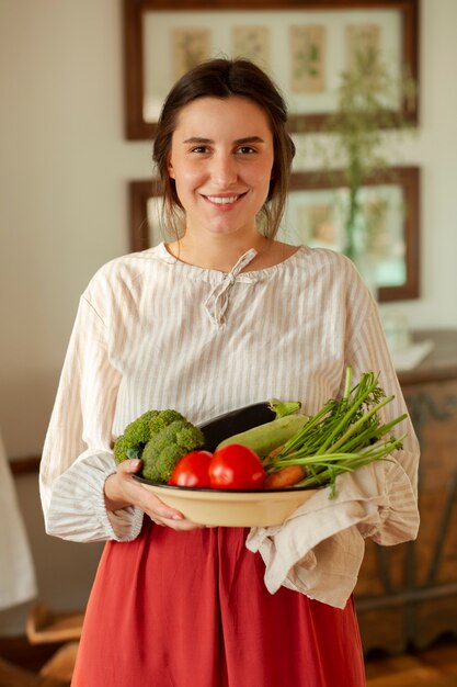 Medium shot woman living at farmhouse