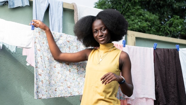 Medium shot woman near laundry