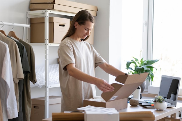 Medium shot woman packing