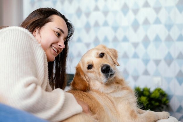 Medium shot woman petting dog