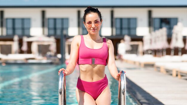 Medium shot of woman at pool