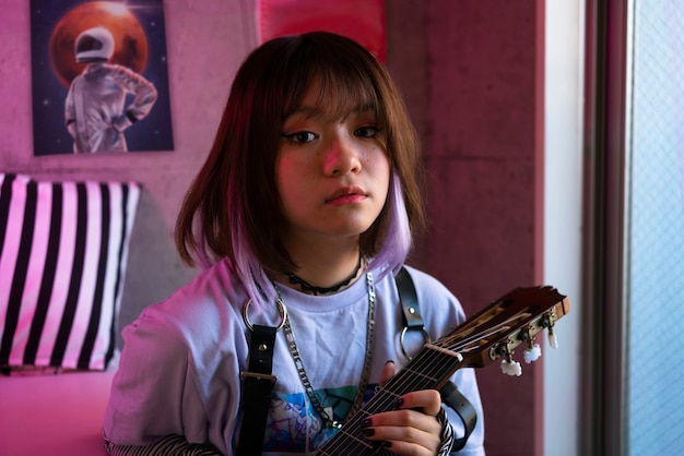 Medium shot woman posing guitar