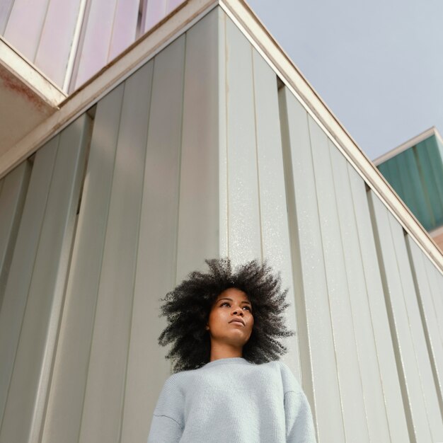 Medium shot woman posing low angle