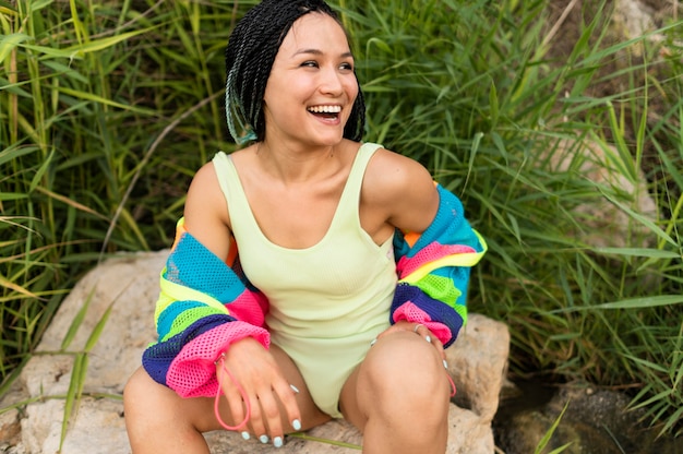 Free photo medium shot woman posing in nature