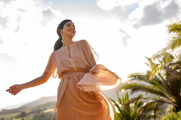 Medium shot woman posing in nature