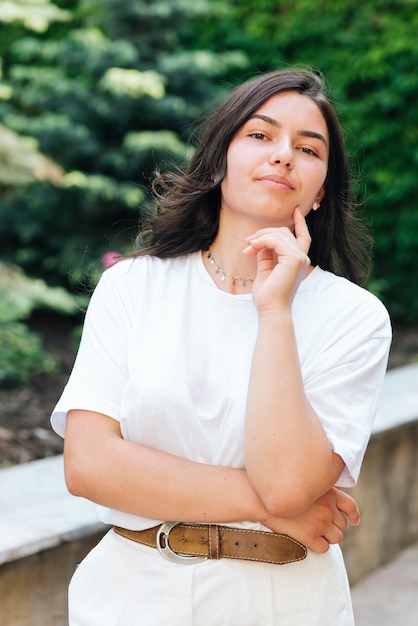 Medium shot woman posing outdoors 